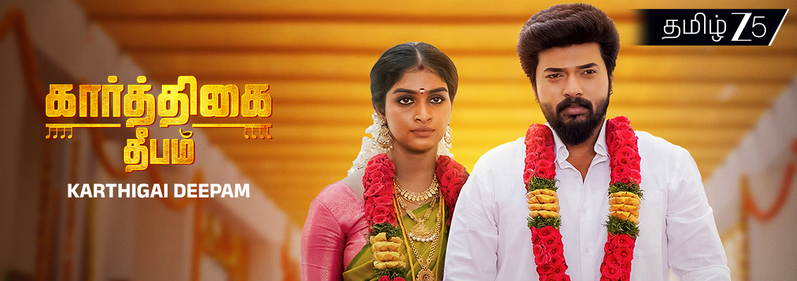 Karthik gifts Revathy a saree as emotional tension and temple conspiracy rise in Karthigai Deepam