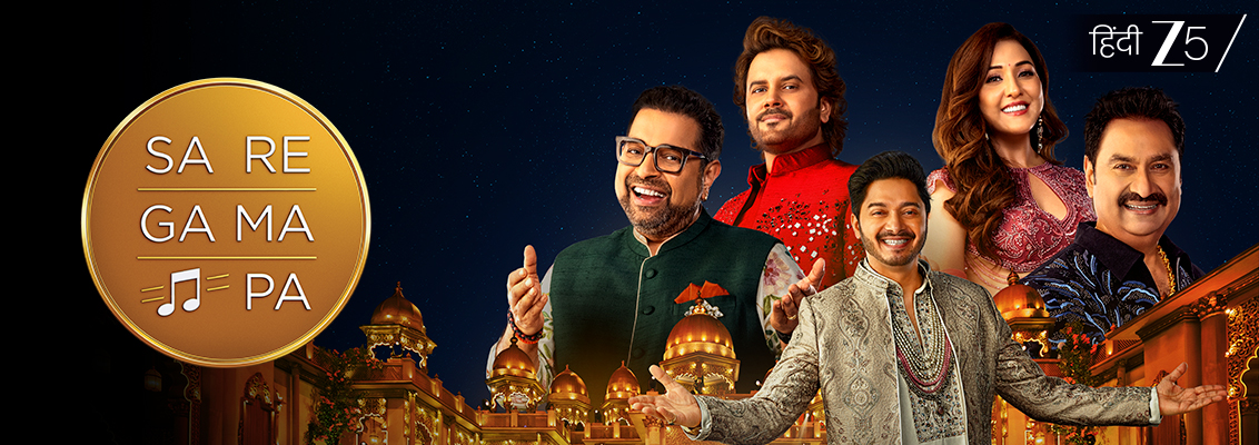 Contestants perform on the grand stage of Sa Re Ga Ma Pa 2026 alongside a live orchestra, as Shankar Mahadevan, Kumar Sanu, Neeti Mohan and Javed Ali mentor India's aspiring singing stars.
